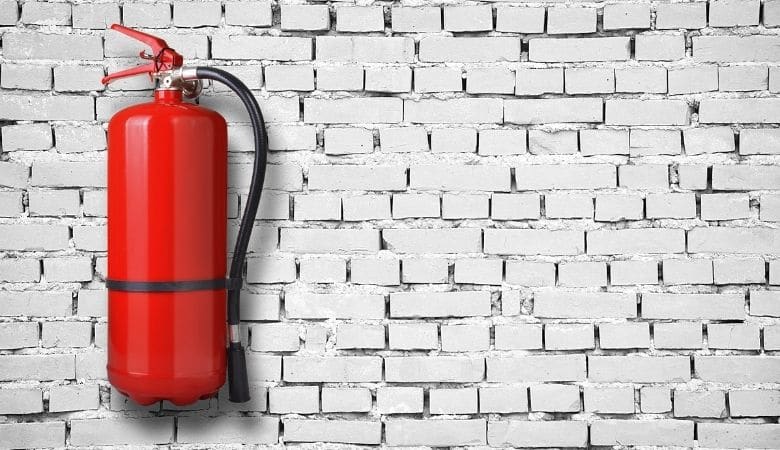 red fire extinguisher on a wall