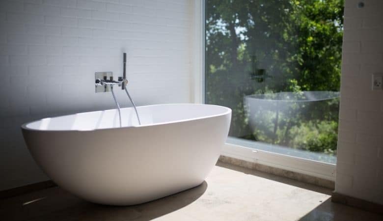 deep round tub next to a wall