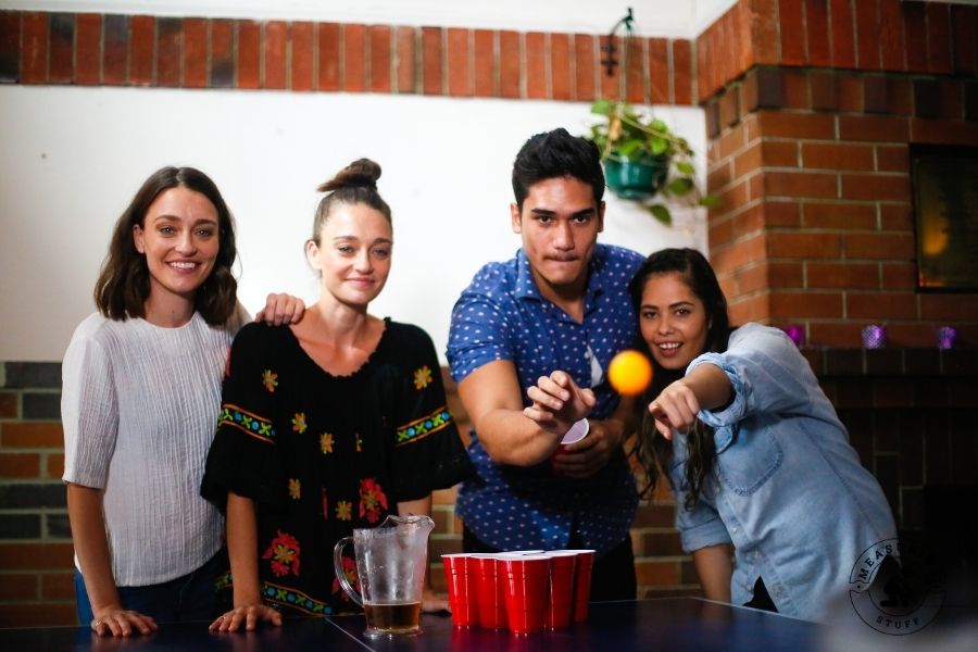 people playing beer pong