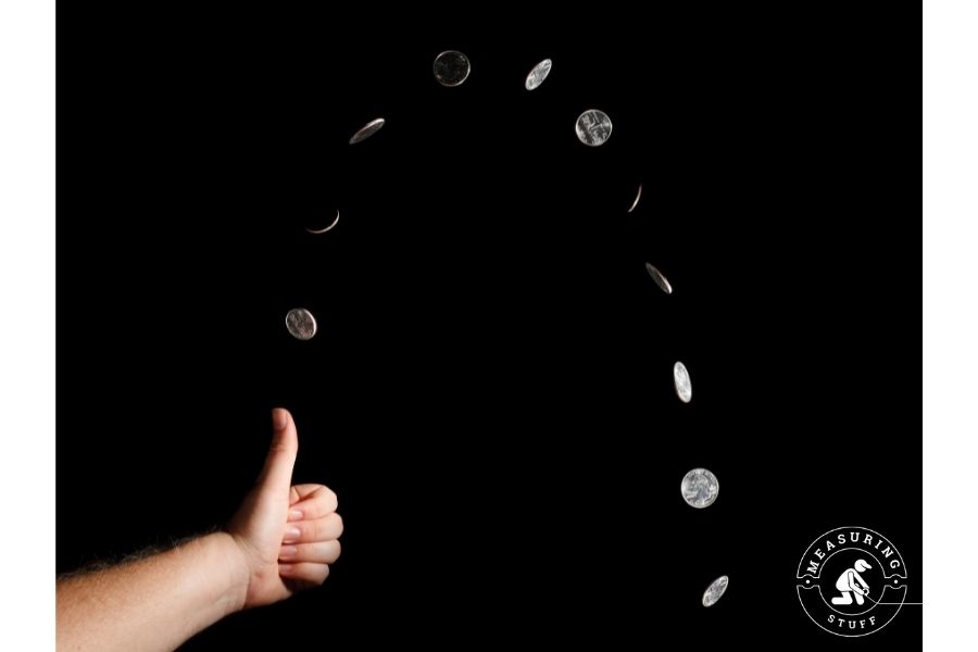 person flipping a coin