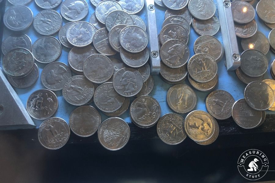 pile of quarters on metal table