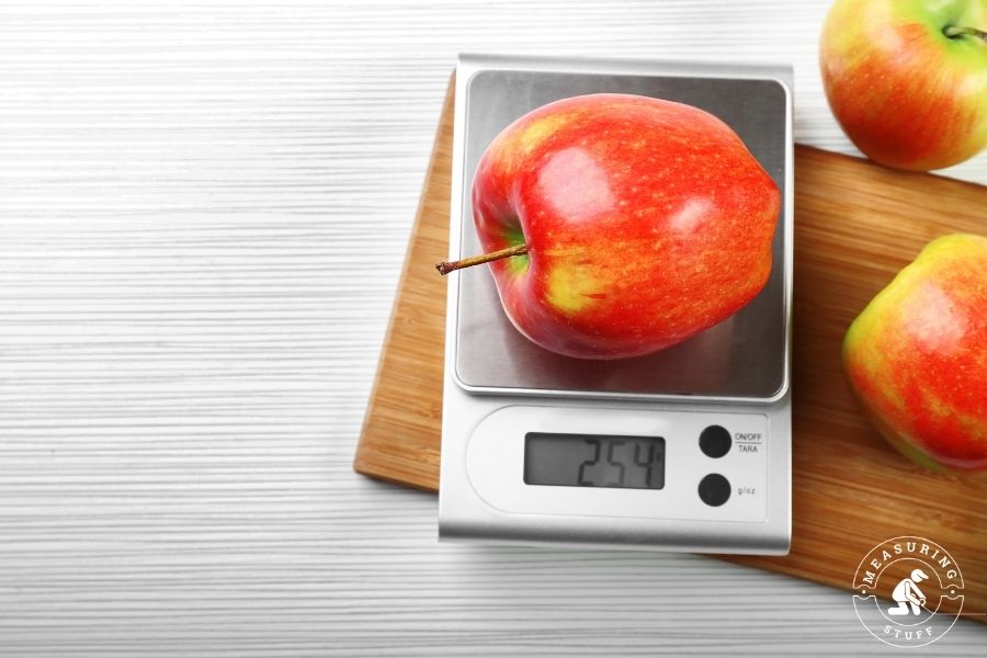 digital scale with weighing an apple