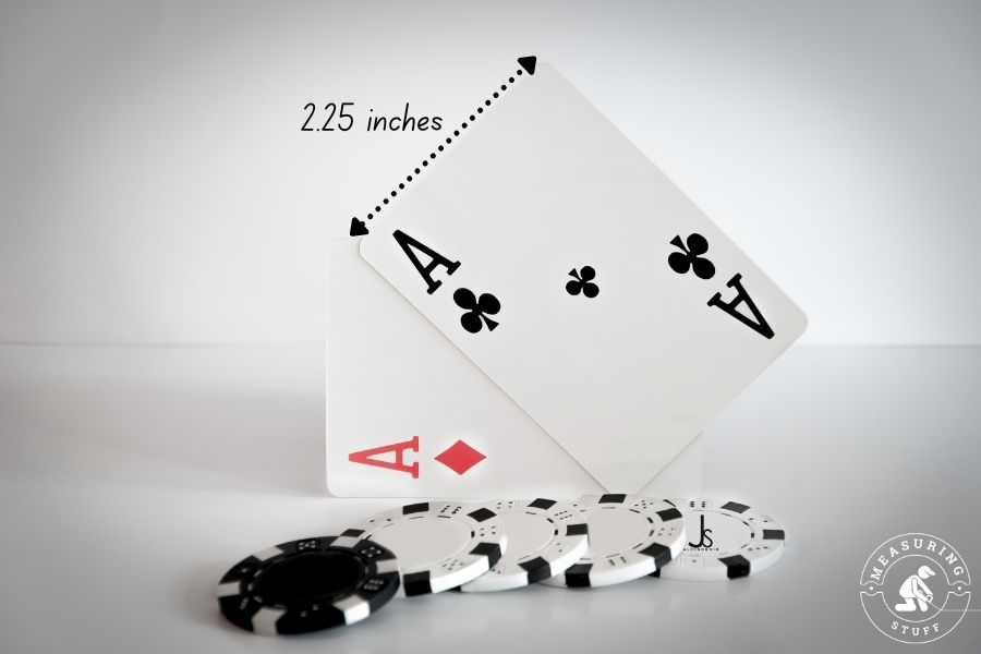 2 aces playing cards with casino chips