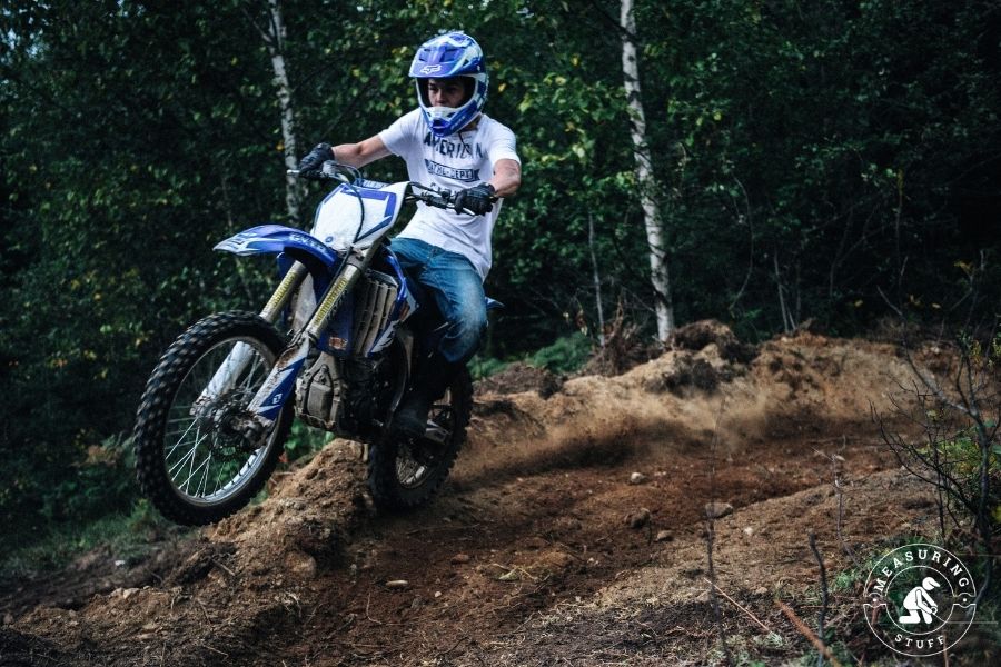 man riding blue dirtbike