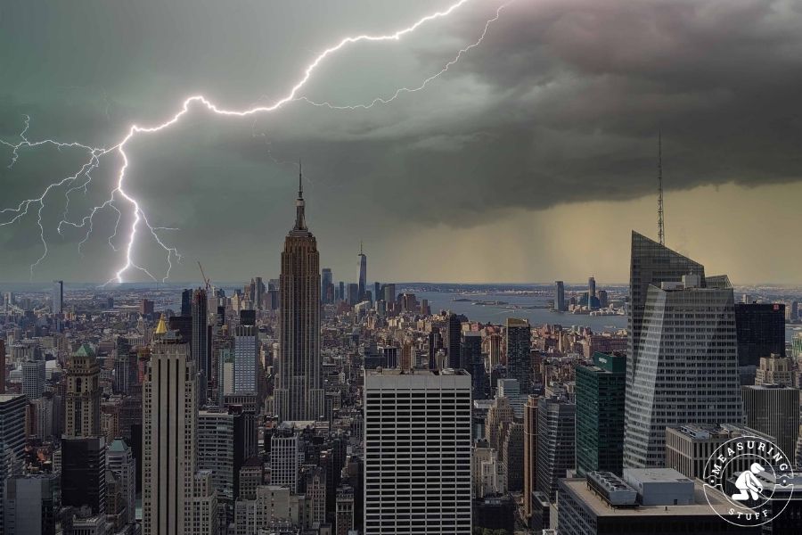 Empire state building with lightning in background