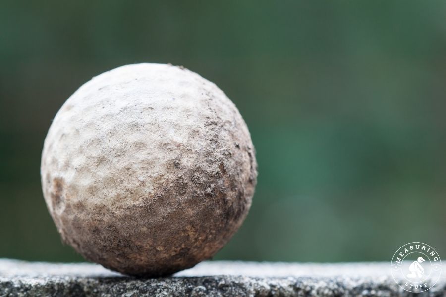 old and worn golf ball