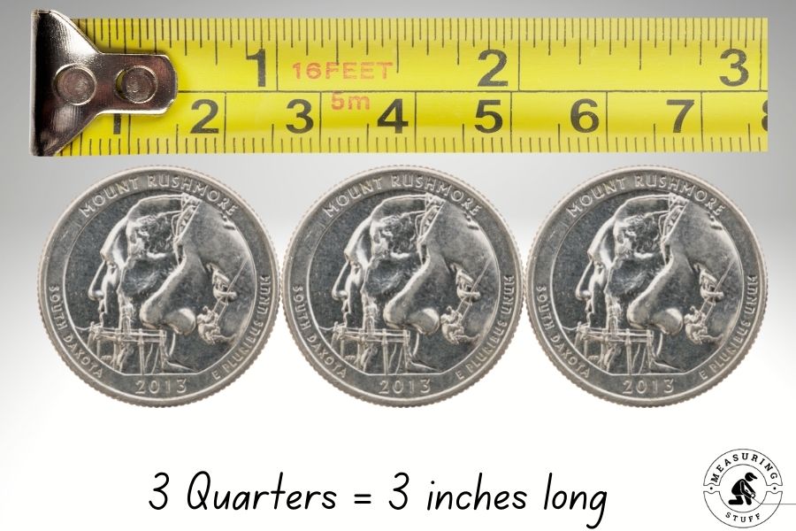 3 quarters measuring 3 inches long