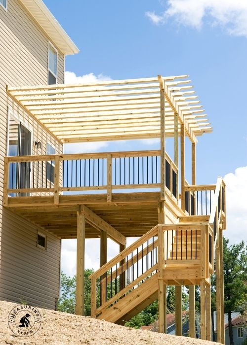deck with pergola and stairs