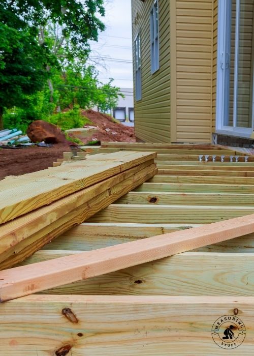 wood boards laying on deck frame