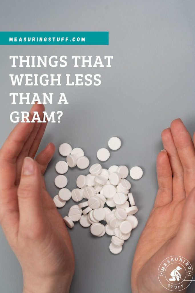 pills with hands on table