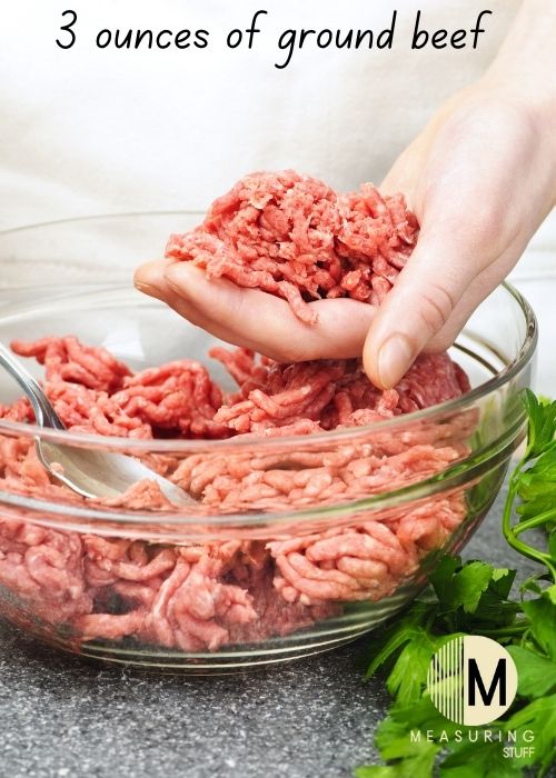 raw ground beef in hand