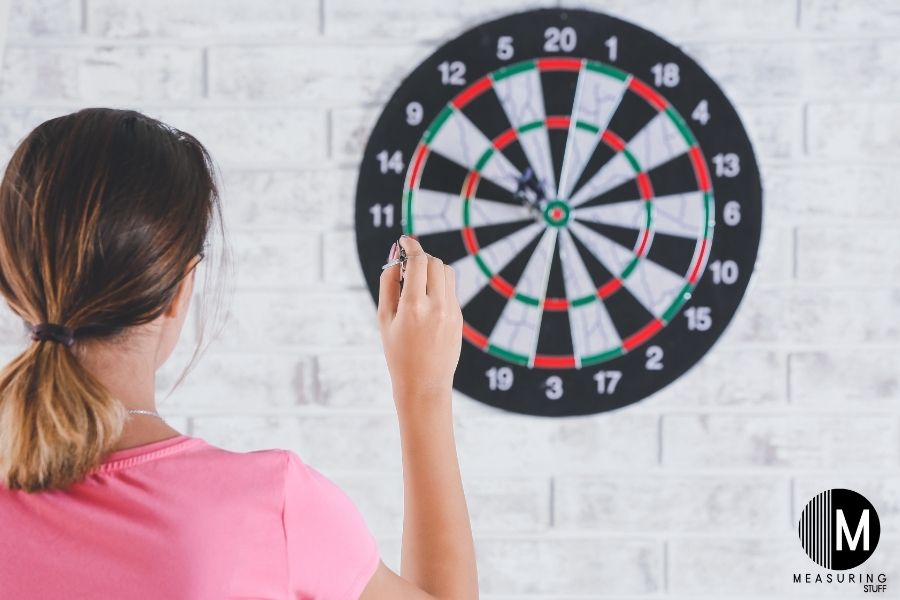 woman playing darts