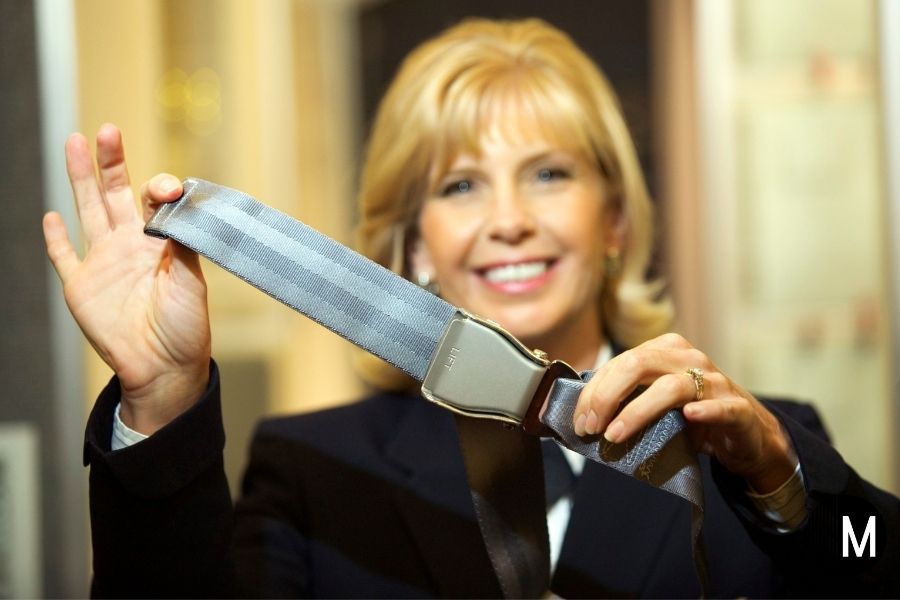 flight attendant with seatbelt