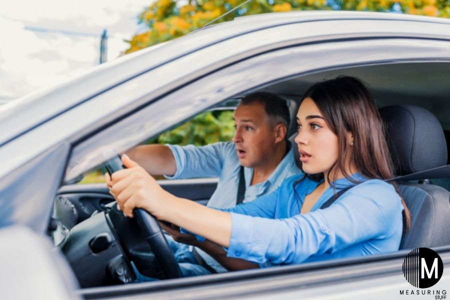man and woman driving