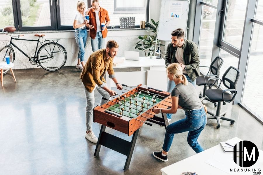 couple playing foosball