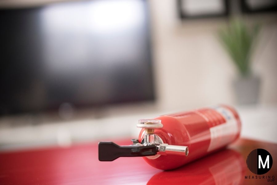 small fire extinguisher on table