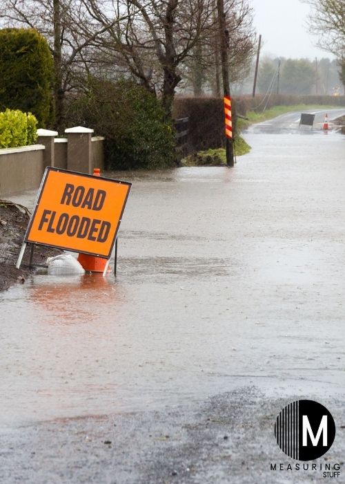 road flooded with orange sign