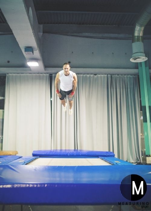 man using square trampoline