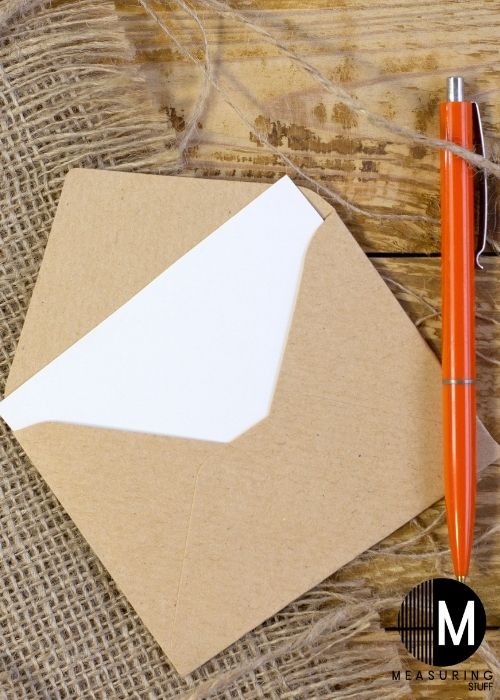 small beige envelope with pen