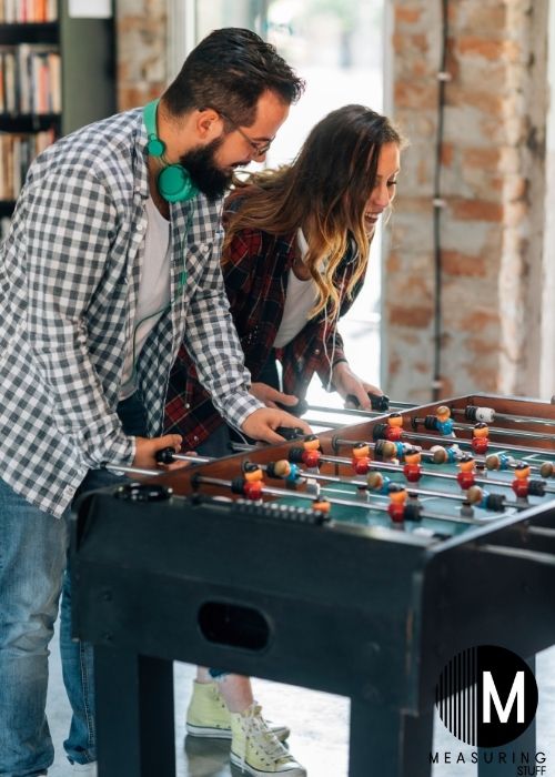 couple playing foosball