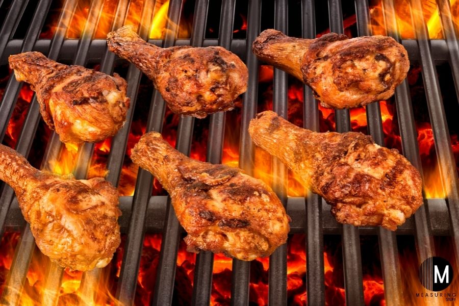 chicken drumsticks on flame