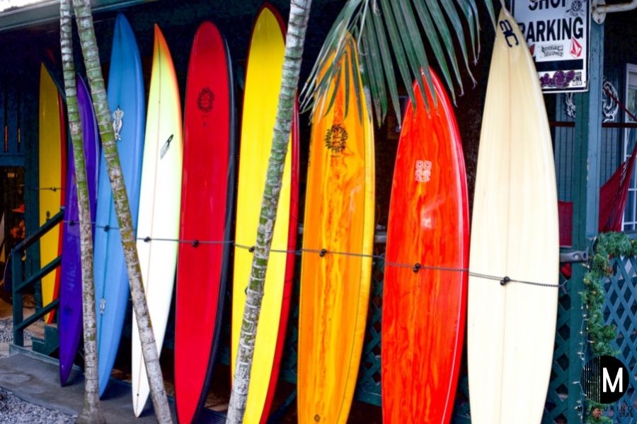 several surfboards against wall
