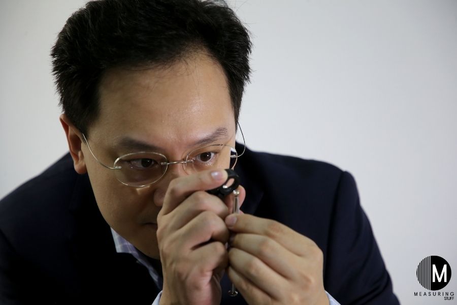 gemologist looking at gem stone