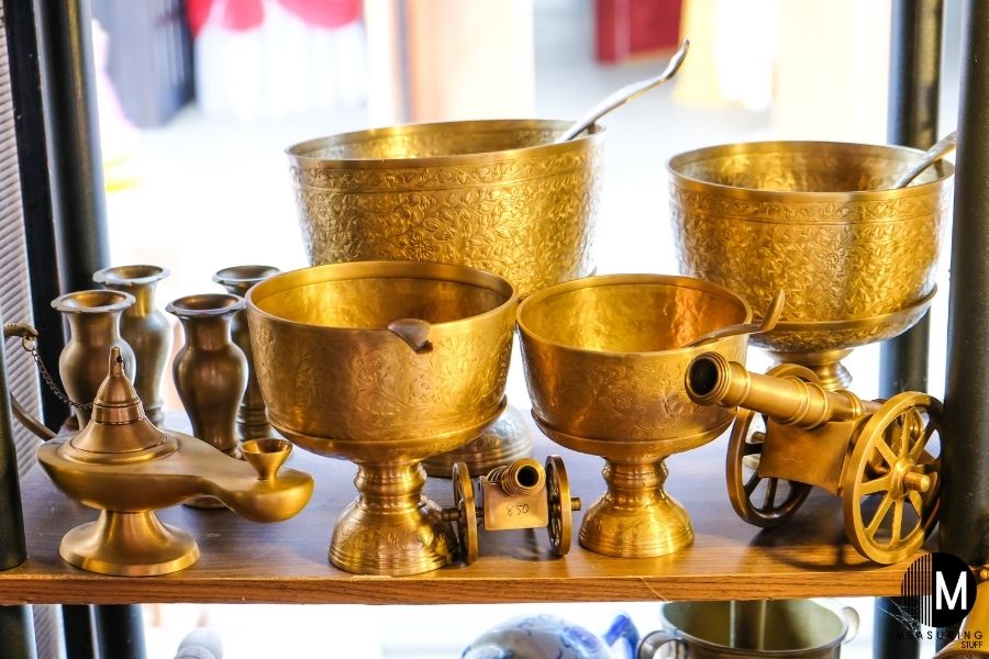 brass decorations on shelf 