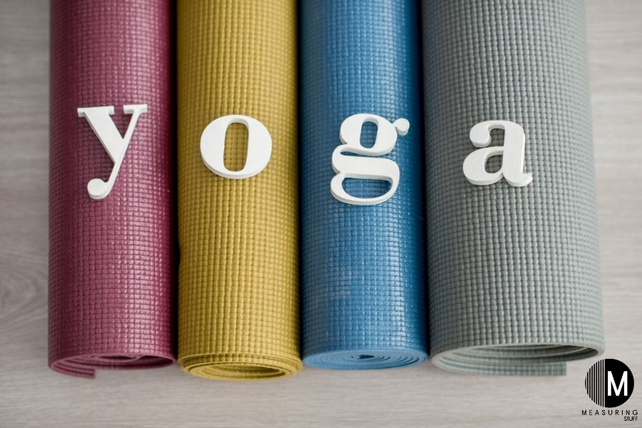 4 yoga mats with yoga letters