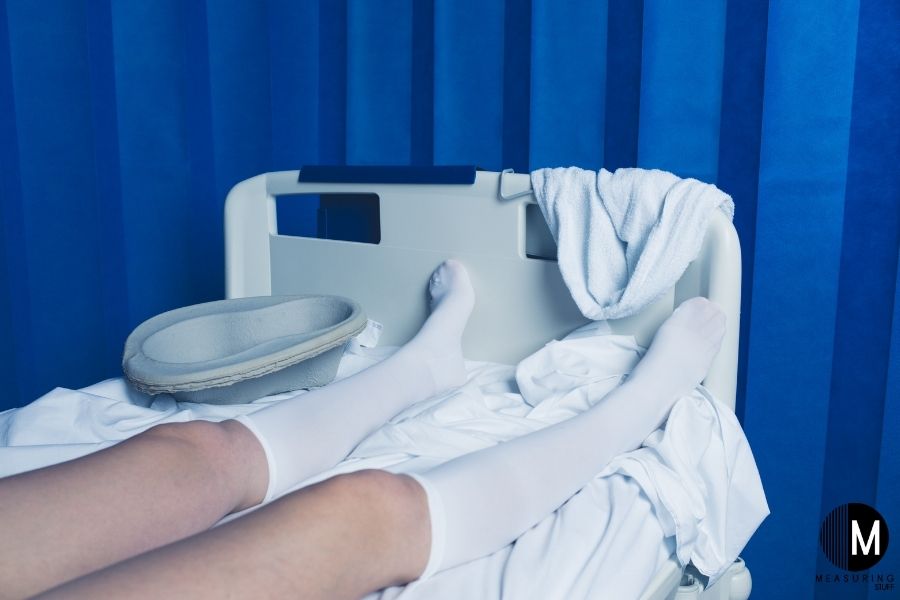 white compression socks in hospital bed