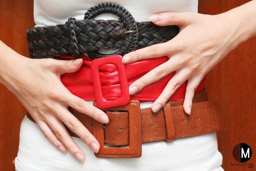 woman wearing 3 belts