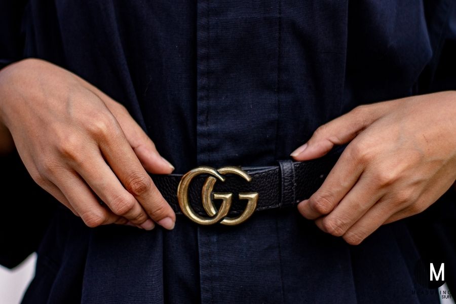 man wearing black GG belt