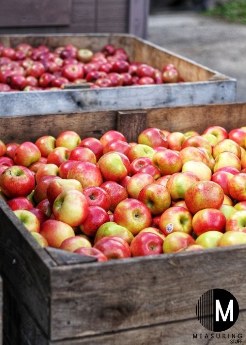 red apples in wooden crate