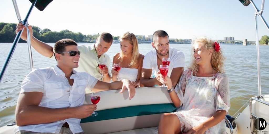 people drinking on pontoon boat
