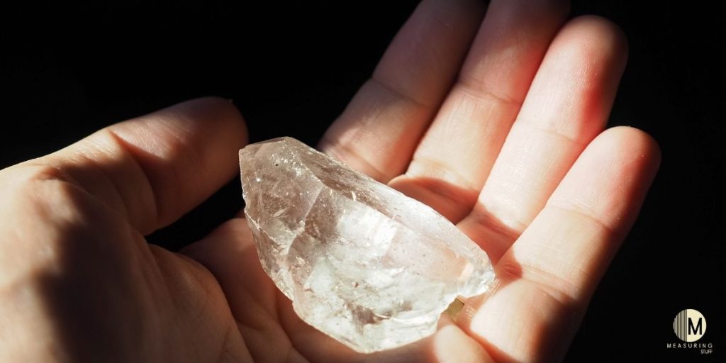 holding clear quartz