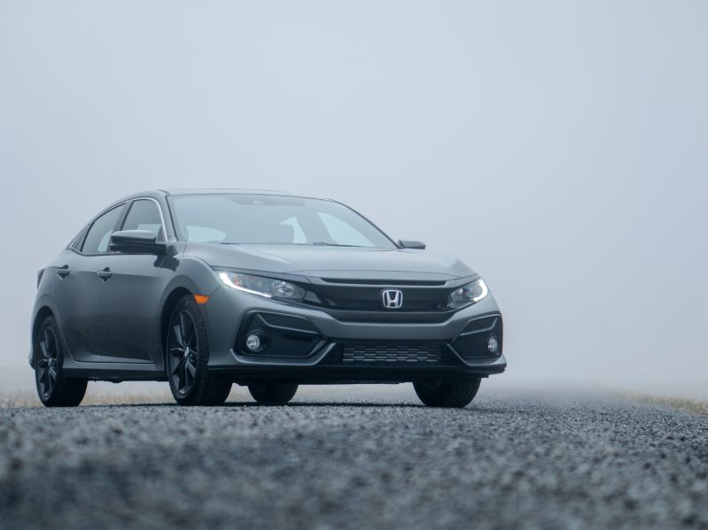 honda civic parked on the highway in fog