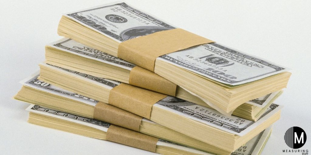 stacks of 100 dollar bills