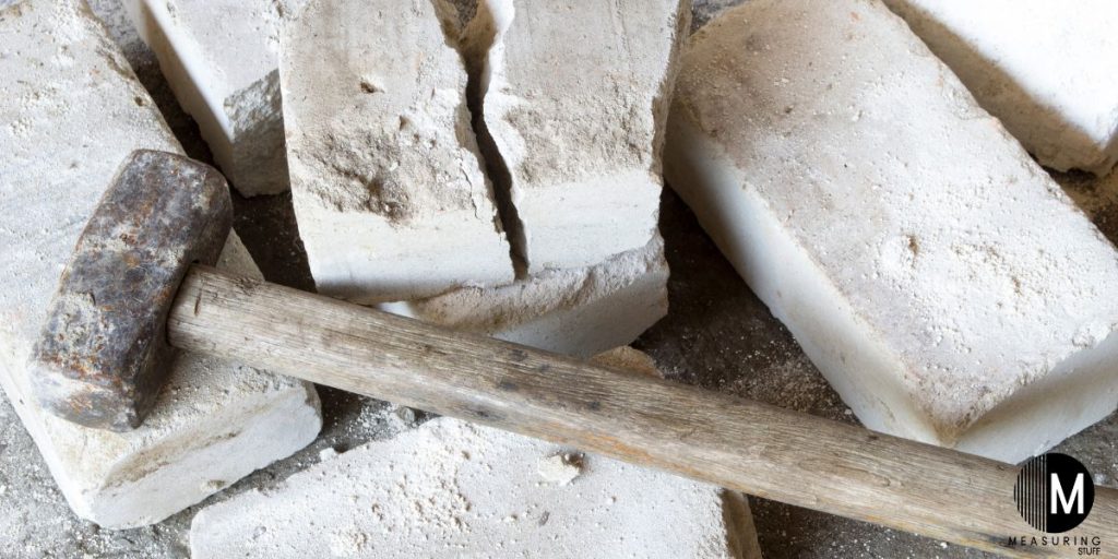 sledgehammer on cement blocks