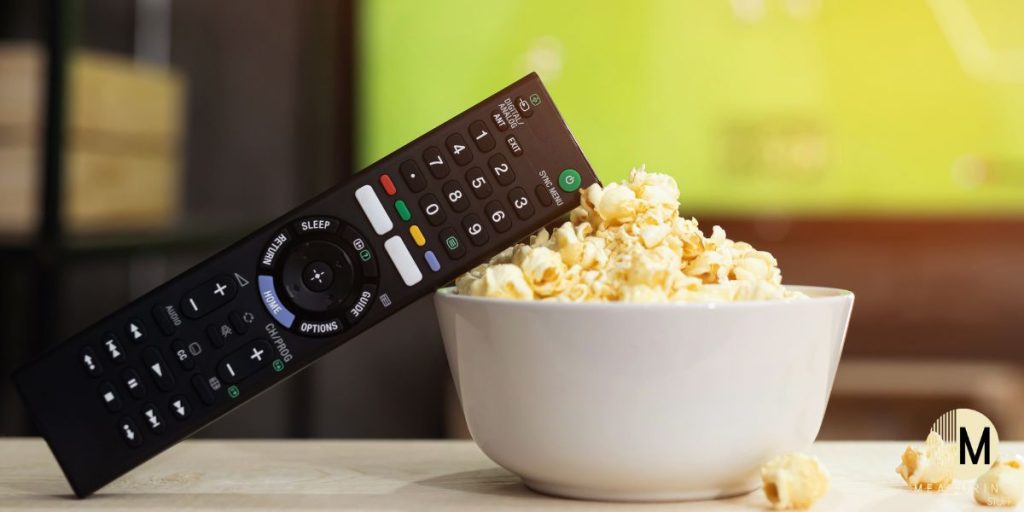 tv remote with popcorn bowl