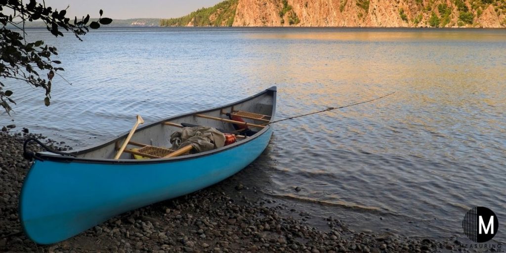 blue canoe on lake