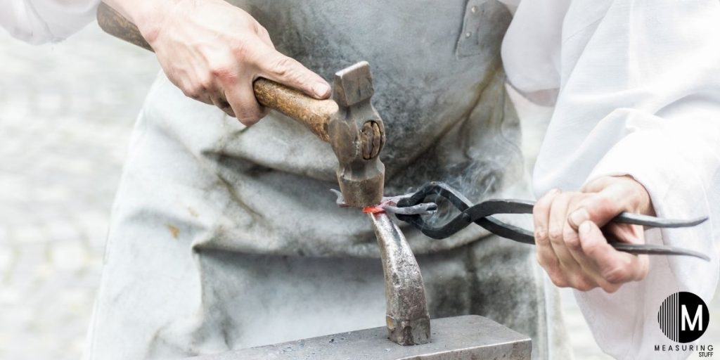 man forging metal
