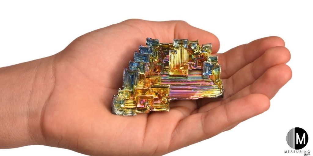 piece of bismuth held in hand