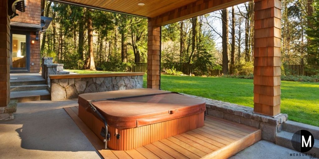 covered hot tub on wooden platform