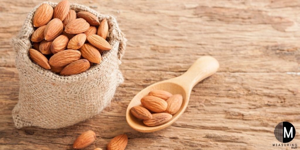 yarn bag and spoon full of almonds