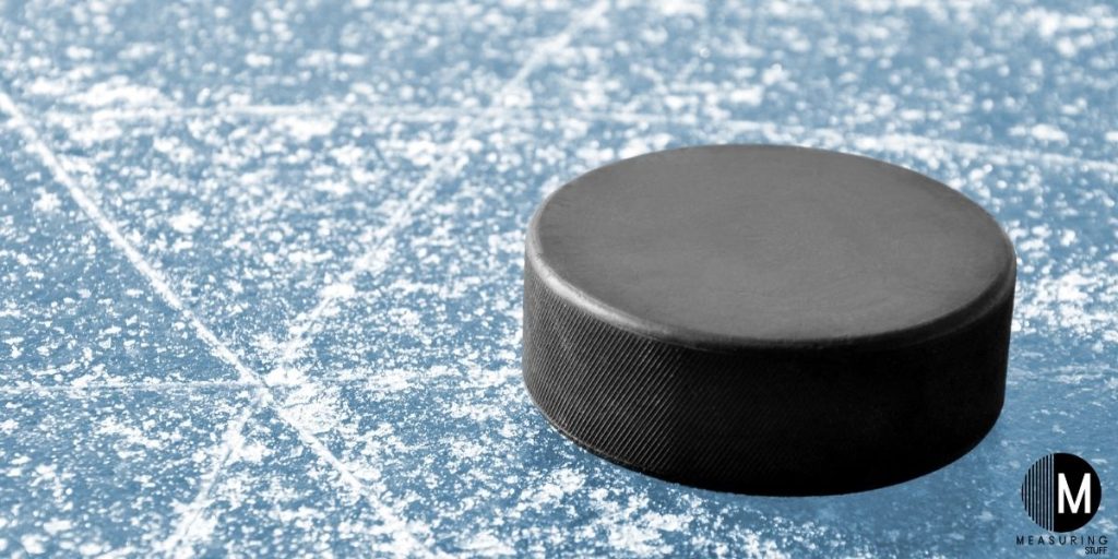 hockey puck sitting on ice