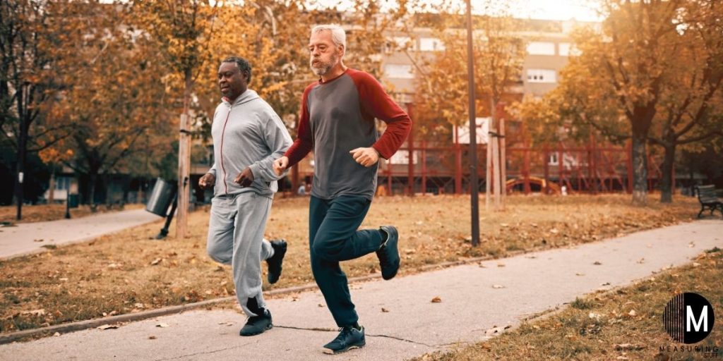 senior men running on sidewalk