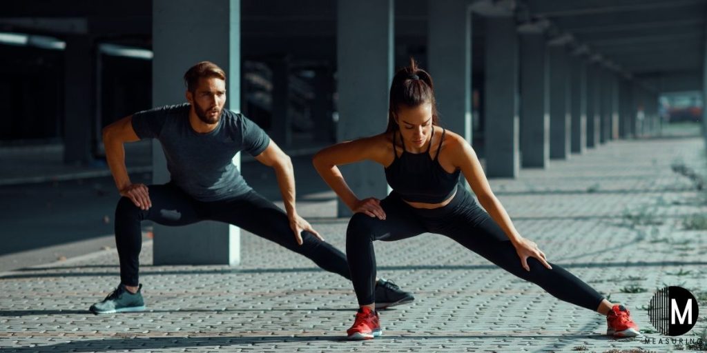 man and woman stretching