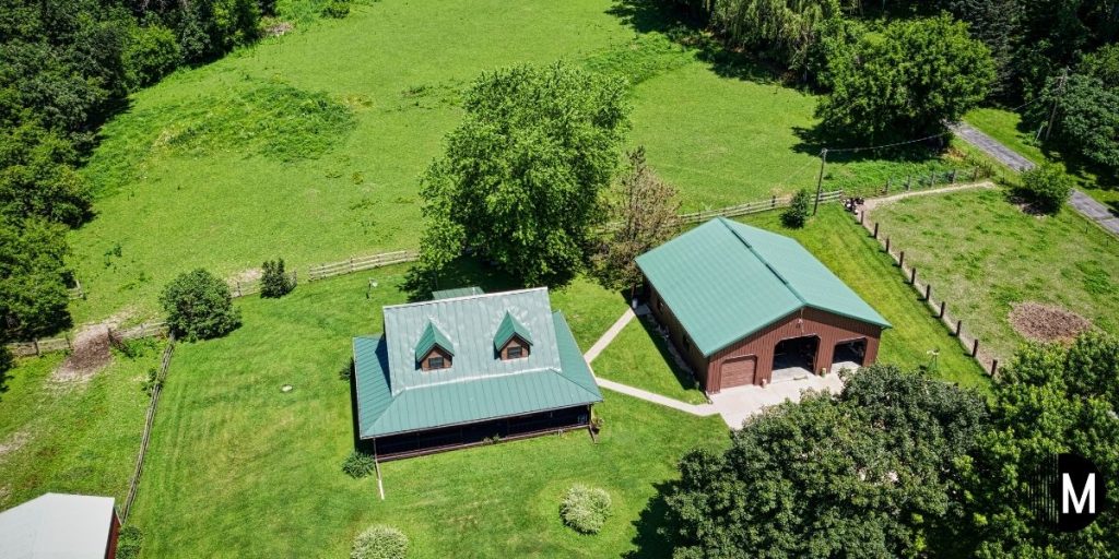 overhead view of home and garage on land