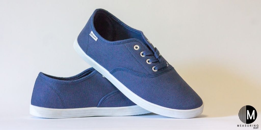 pair of blue lace up sneakers