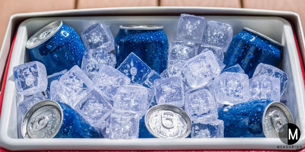 cooler filled with ice and soda cans